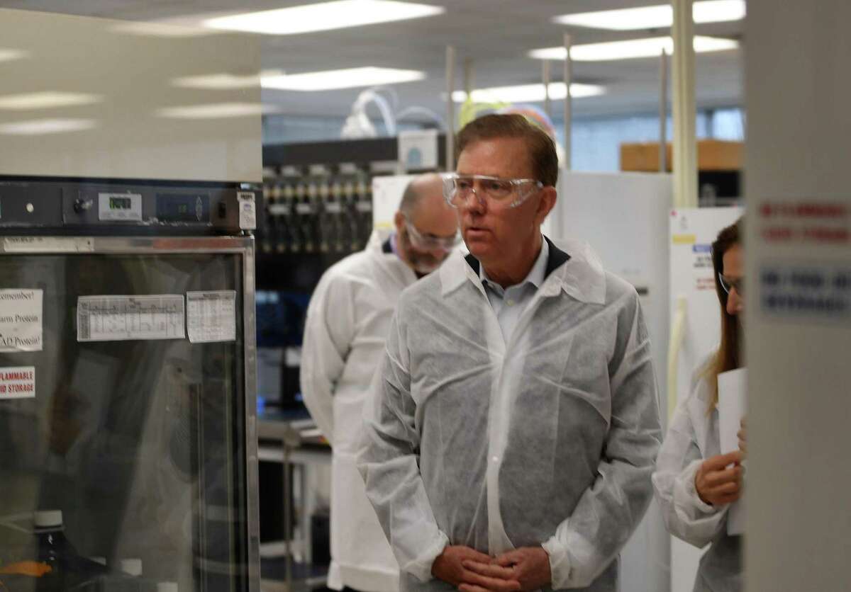 Gov. Ned Lamont and Lt. Gov. Susan Bysiewicz tour the lab at Protein Sciences Corp. in Meriden on Thursday. The company is working on a vaccine for the coronavirus.