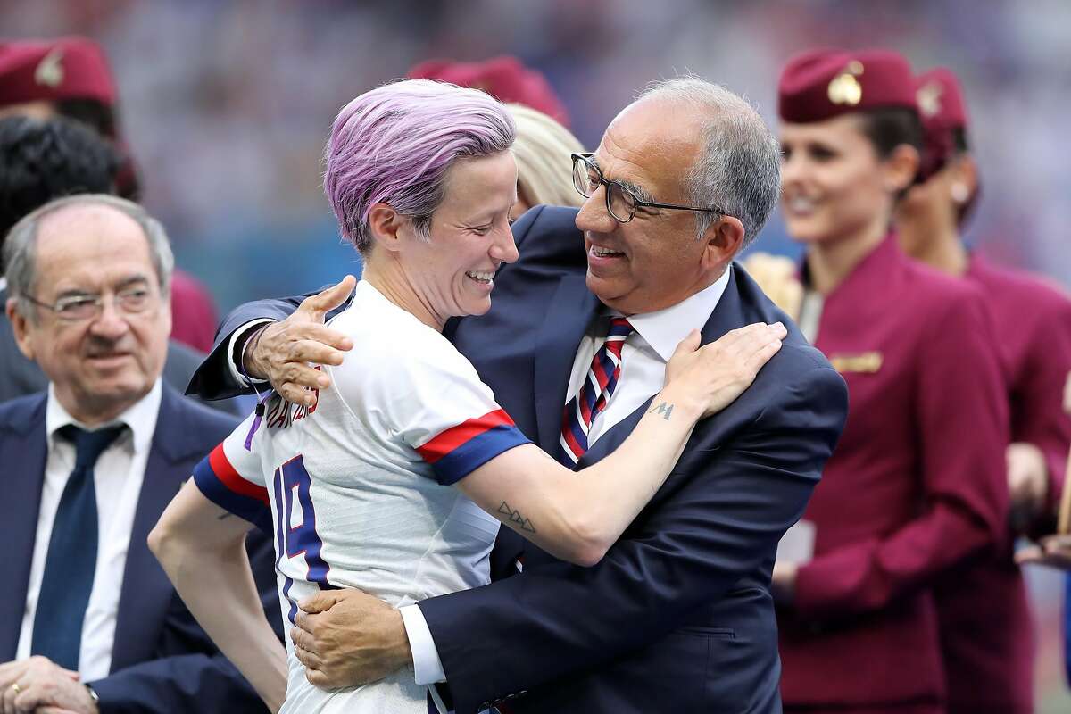 FILE PHOTO: US Soccer President Carlos Cordeiro resigns after taking responsibility for the 'offensive' language which was used in court papers submitted in an equal pay case with the USWNT. LYON, FRANCE - JULY 07: Megan Rapinoe of the USA and Carlos Cordeiro, President of the USA Soccer Federation celebrate following their sides victory in the 2019 FIFA Women's World Cup France Final match between The United States of America and The Netherlands at Stade de Lyon on July 07, 2019 in Lyon, France. (Photo by Elsa/Getty Images)