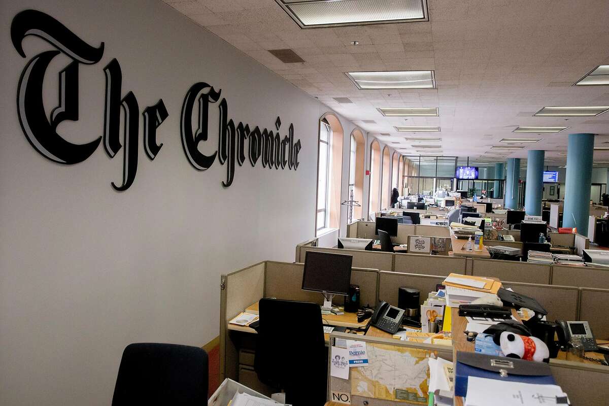 Desks sit empty in the San Francisco Chronicle newsroom on Mission Street in San Francisco, Calif. Saturday, March 14, 2020. For the first time in the newspaper's 155-year history, its editorial staff made the decision to place a mandatory work from home policy on newsroom staff amid the Coronavirus threat.