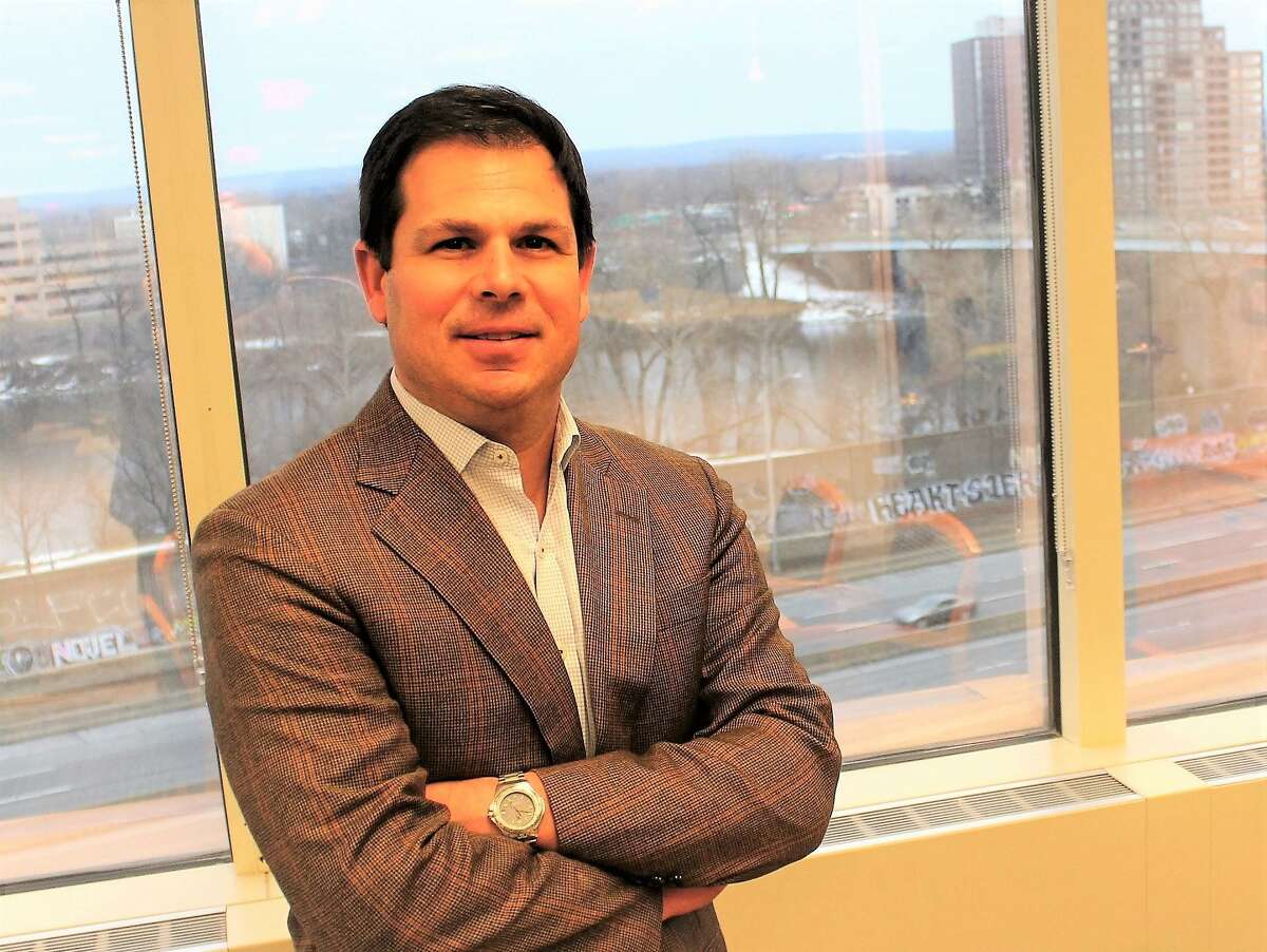 David Lehman, state Commissioner of Economic and Community Development, in his office overlooking the Connecticut River in Hartford.
