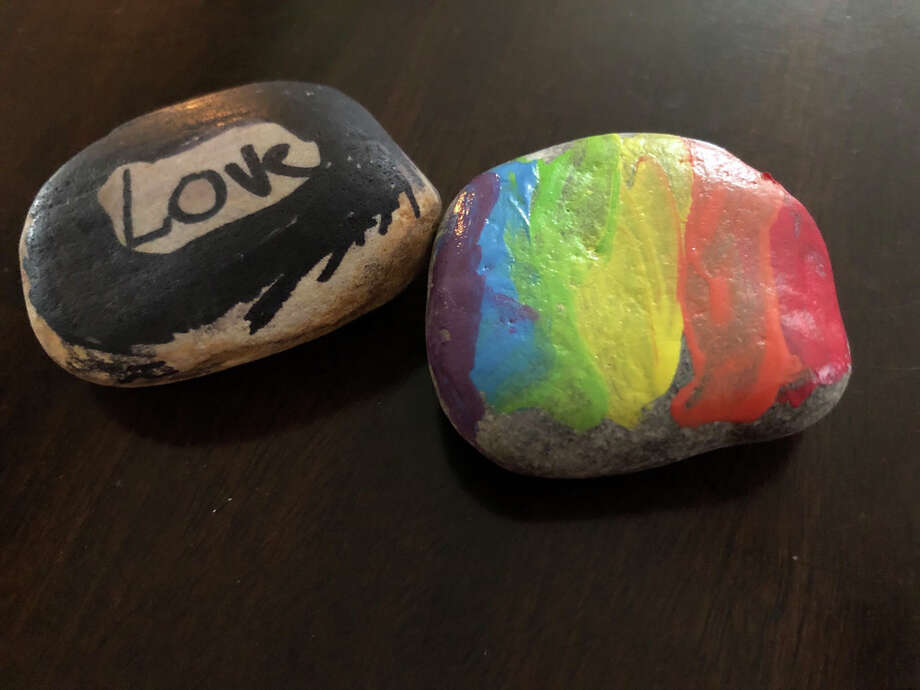 What to do with kids if you’re stuck at home? Paint rocks from your yard. It can actually be fun. Photo: Joey Guerra