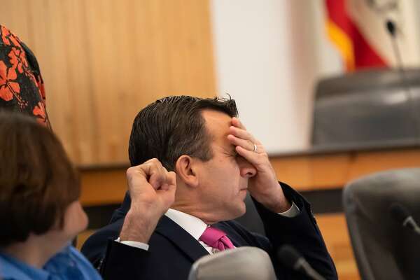 San Jose mayor Sam Liccardo stretches during a break at the Metropolitan Transportation Commission meeting on Friday, March 13, 2020, in San Francisco, Calif. Santa Clara County has 37 coronavirus cases, one of them fatal. Because it had so many coronavirus patients early, the county has been on the leading edge in efforts to contain the spread of the illness.