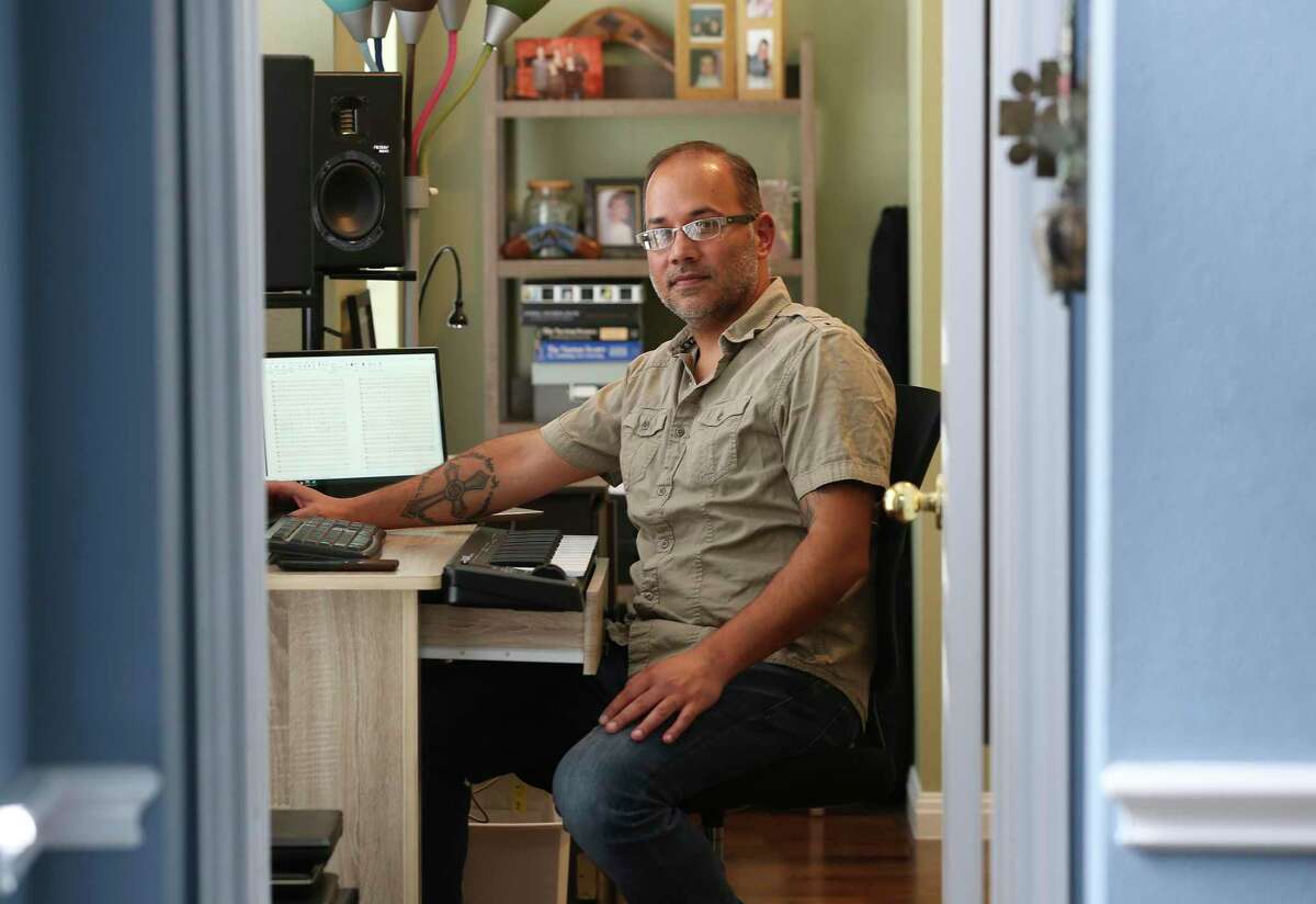 Clarinetist and composer Joe Samuel, 45, sits in the den on Friday, nearing the end of a self-quarantine at his Stone Oak area house. He was in Urbino, Italy, in late February when he got word from UTSA that his three-month trip to study at the Rossini Conservatory of Music in nearby Pesaro would be ended due to the spread of the coronavirus.