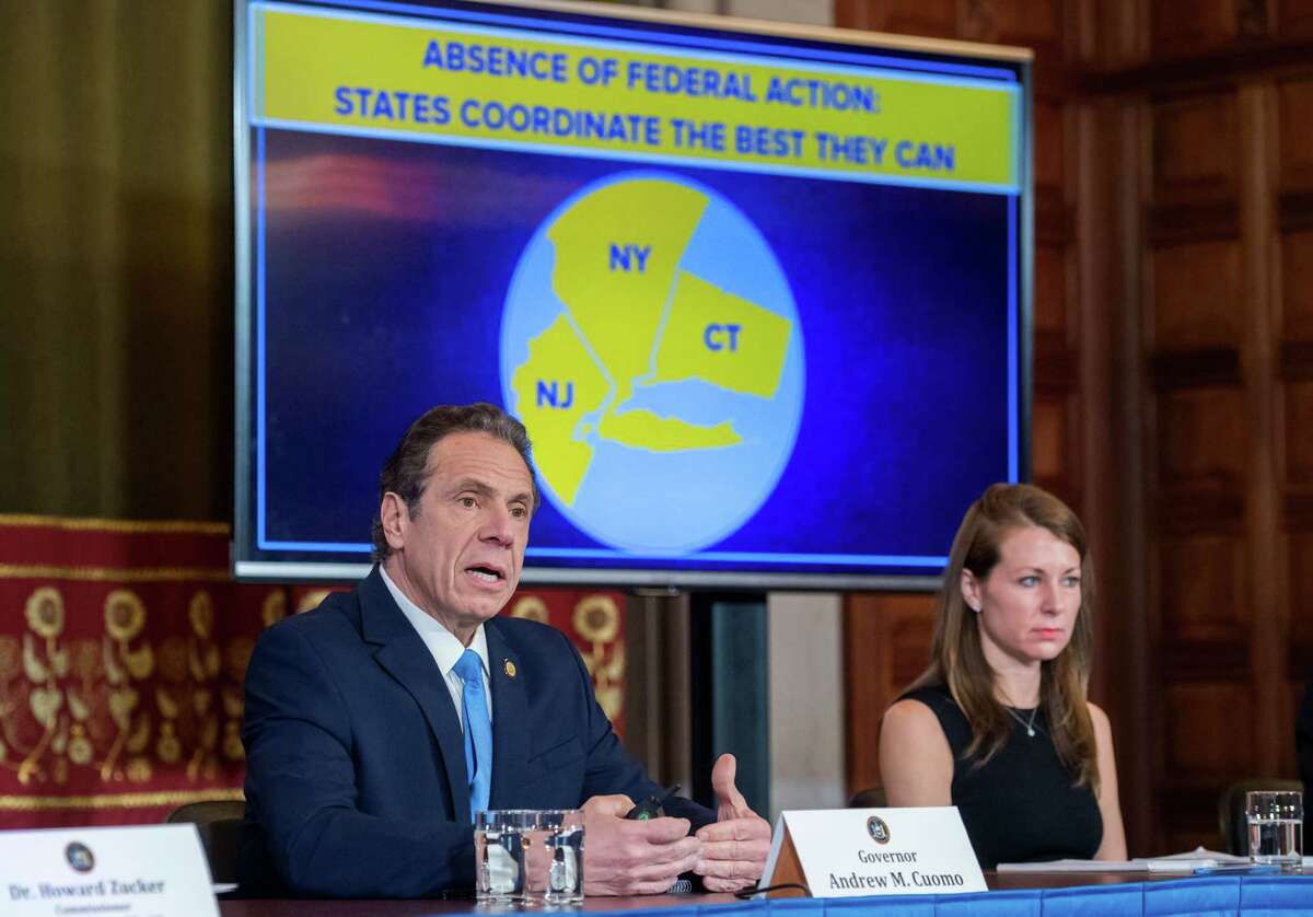 Gov. Andrew Cuomo holds a briefing on coronavirus where he announced partnerships with New Jersey and Connecticut to close bars, restaurants, movie theaters, gyms, casinos and limit public gatherings to 50 people starting at 8 p.m. on Monday, March 15, 2020, in the Red Room at the Capitol in Albany, N.Y. Bars and restaurants can remain open for takeout and delivery only, and will be granted a waiver for carry-out alcohol.