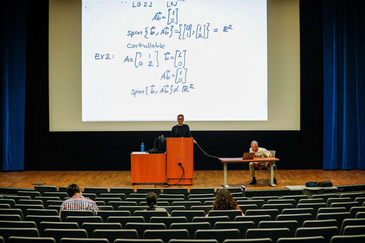Professor Murat Arcak (center) and Professor Seth Sanders teach a Linear Systems class at Wheeler Hall where normally over 300 students are in attendance on Tuesday, March 10, 2020 in Berkeley, California.UC Berkeley announced yesterday that is has suspended in-person classes through the end of Spring break due to the coronavirus.