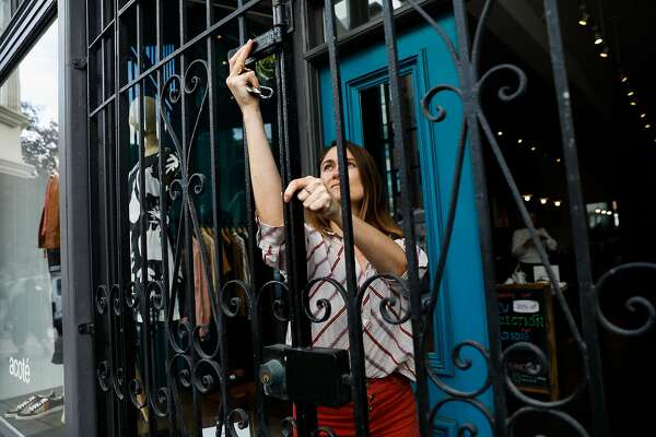 Store manager Kathryn Sandretto closes clothing store Acoté after learning that six Bay Area counties would shelter in place.