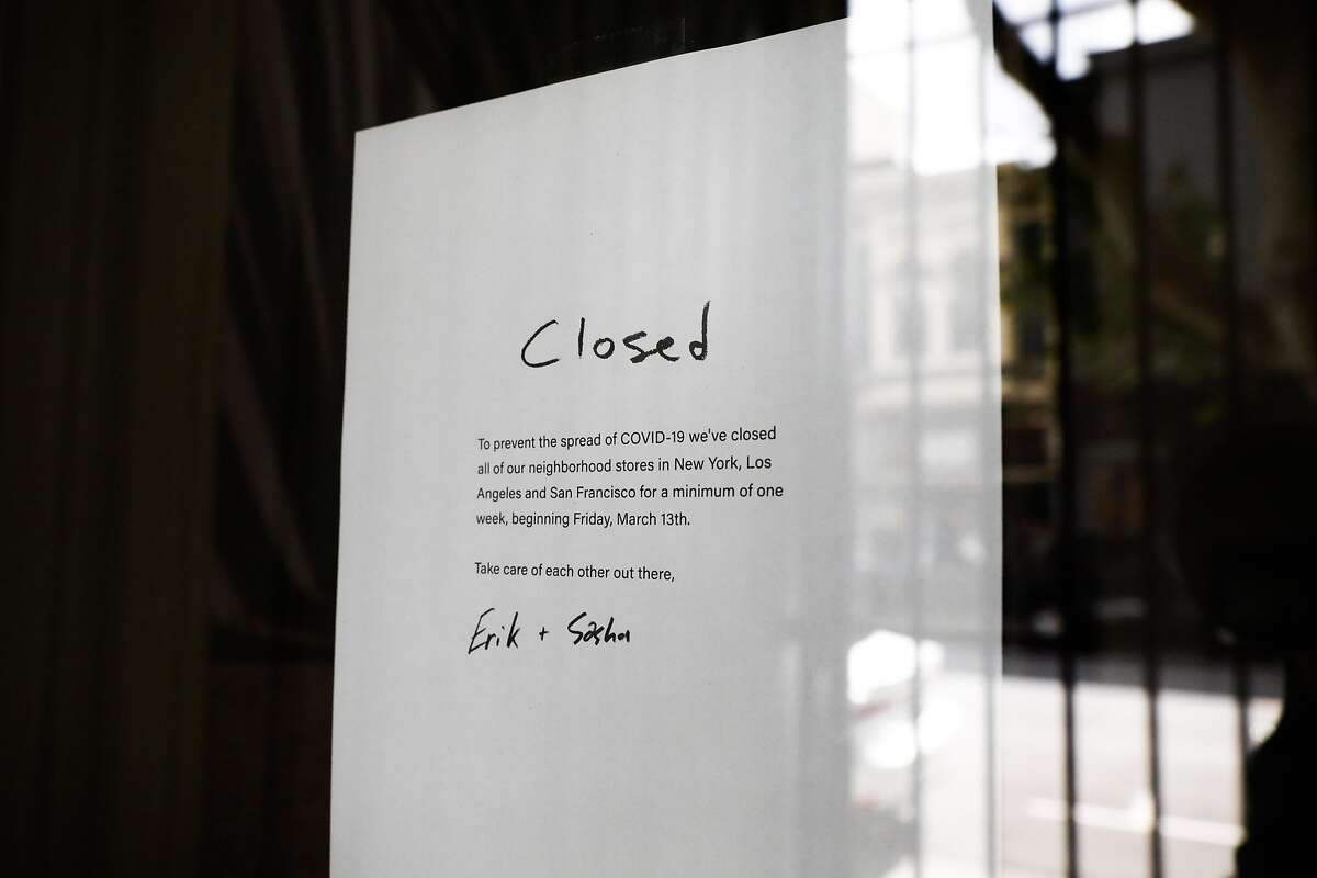 A sign in a shop in Hayes Valley announces its closure due to the coronavirus.