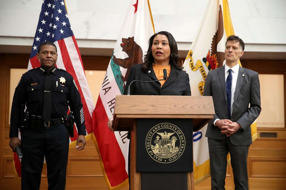 SAN FRANCISCO, CALIFORNIA - MARCH 16: San Francisco Mayor London Breed (C) speaks during a press conference as San Francisco police chief William Scott (L) and San Francisco Department of Public Health director Dr. Grant Colfax (R) look on at San Francisco City Hall on March 16, 2020 in San Francisco, California. San Francisco Mayor London Breed announced a shelter in place order for residents in San Francisco until April 7. The order will allow people to leave their homes to do essential tasks such as grocery shopping and pet walking. (Photo by Justin Sullivan/Getty Images)