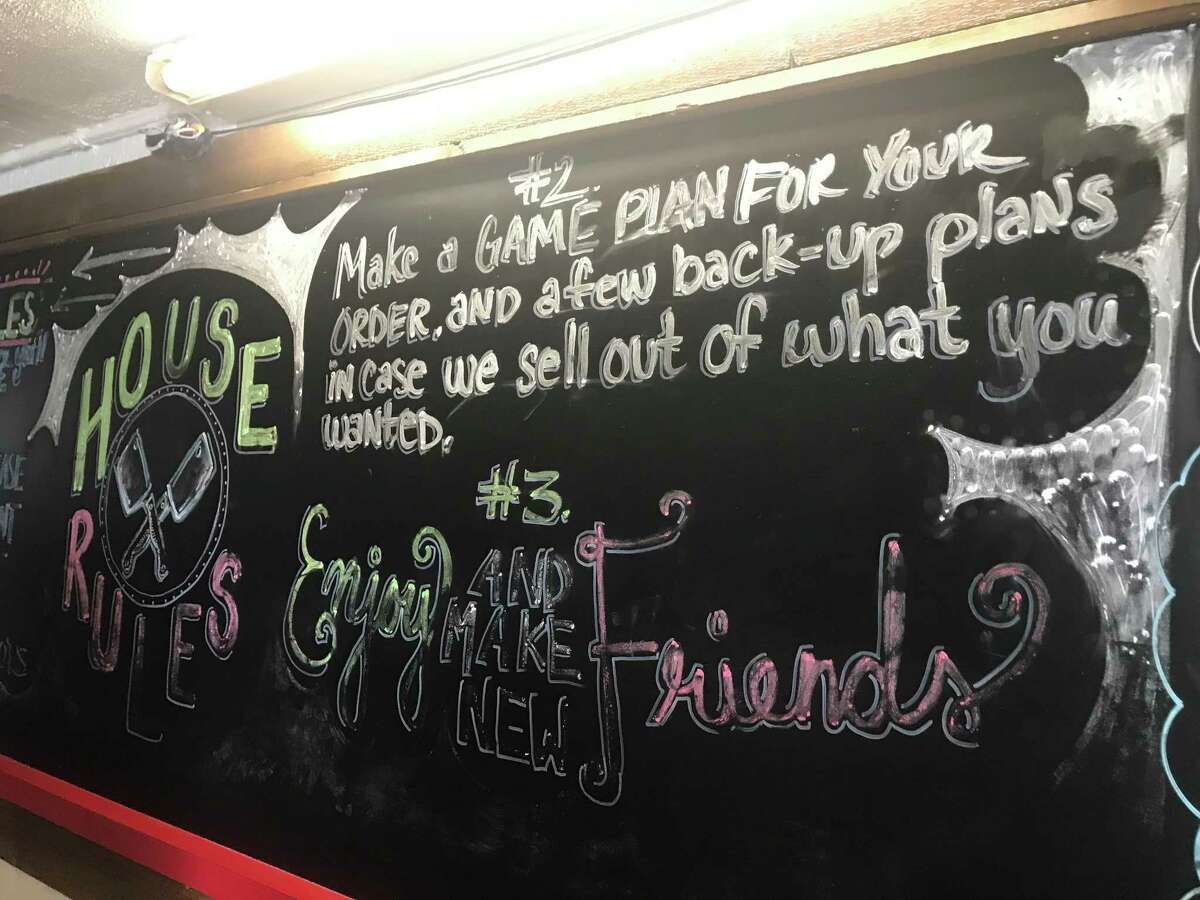 House rule No. 3 at 2M Smokehouse in San Antonio: "Enjoy and make new friends."