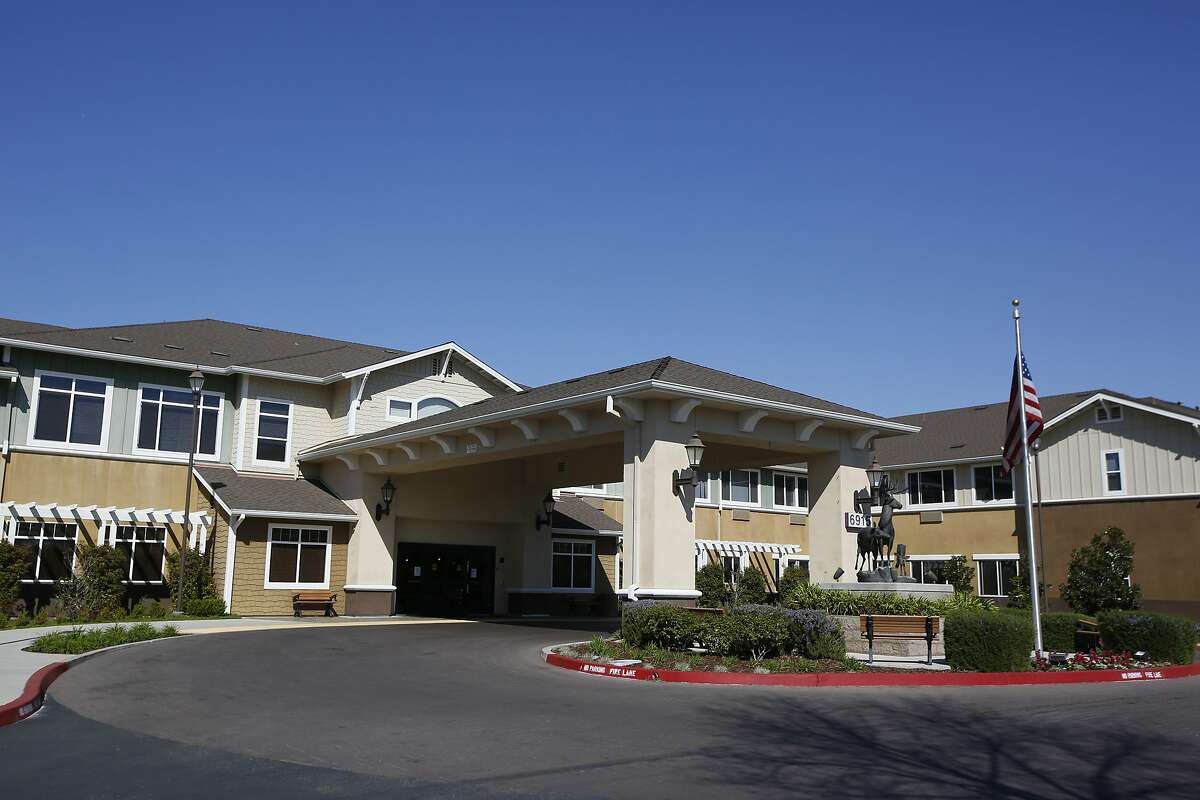 The Carlton Senior Living Facility is seen in Elk Grove, Calif., Wednesday, March 11, 2020. The facility has been placed on a two-week quarantine after a resident, a woman in her 90s, died of the new coronavirus, officials said. (AP Photo/Rich Pedroncelli)