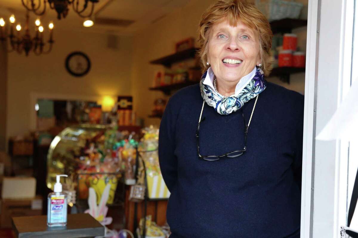 Nancy Saxe, owner of Sweet Pierre’s, is welcoming customers into the store one at a time, where they’re requested to make use of hand sanitizer.