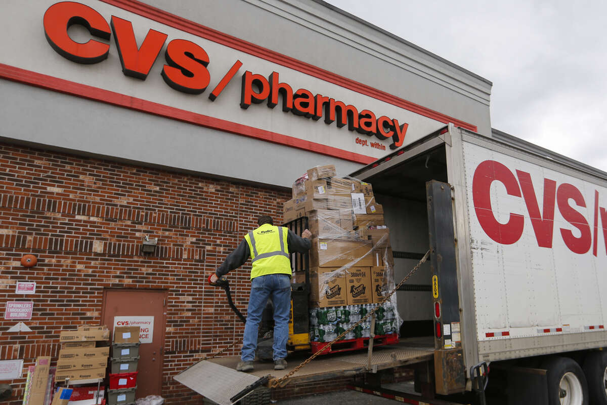A driver unloads merchandise from a delivery truck outside a CVS Health Corp. location in New Rochelle, New York, U.S., on Monday, March 16, 2020. The governors of New York, New Jersey and Connecticut banned all gatherings of 50 or more people, and said bars, restaurants, casinos and gyms must close Monday at 8 p.m. Photographer: Angus Mordant/Bloomberg