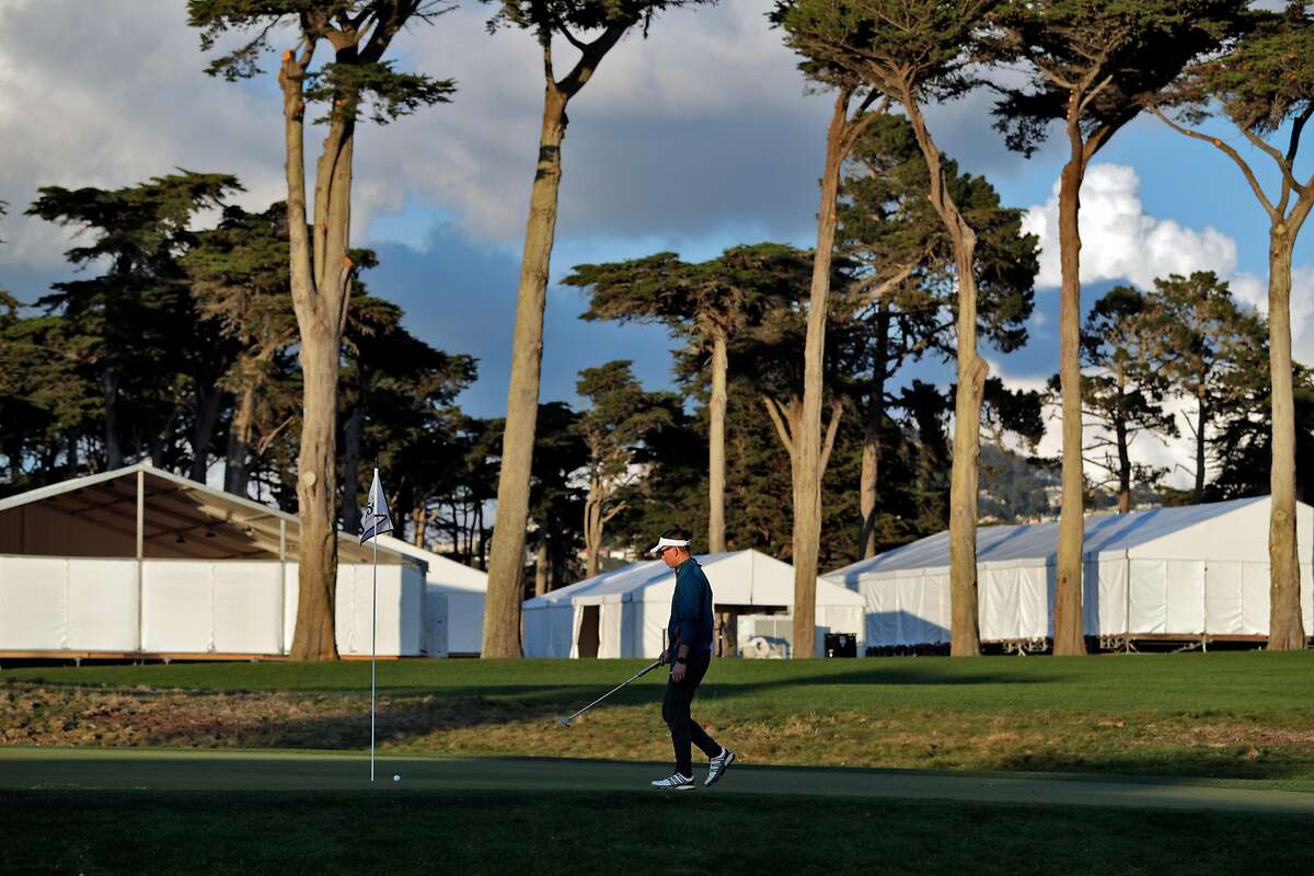 Johnson Lin finishes off the ninth hole at TPC Harding Park where preparations are underway for the 2020 PGA Championship in San Francisco, Calif., on Monday, March 16, 2020.