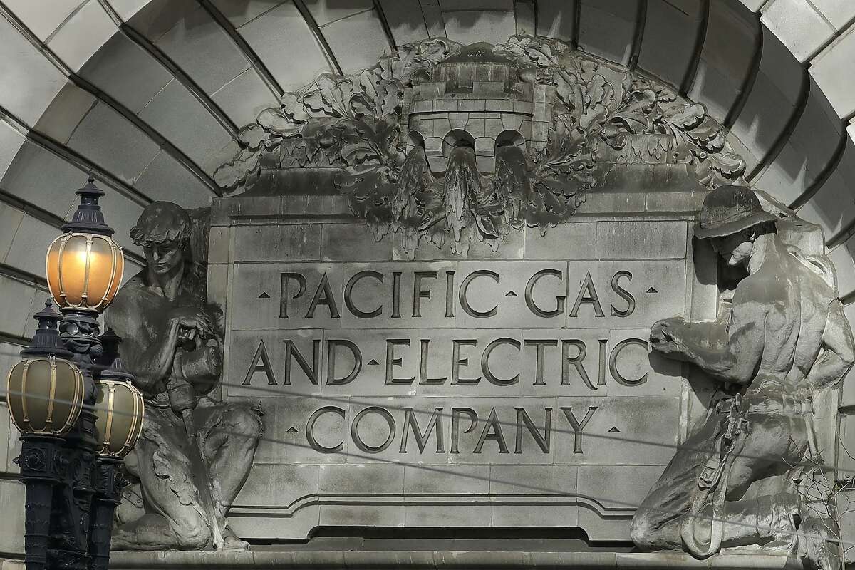 FILE - In this Oct. 10, 2019, file photo a Pacific Gas & Electric sign is shown outside of a PG&E building in San Francisco. Pacific Gas and Electric said Tuesday, Feb. 18, 2020, that it expects to become more profitable than ever after it emerges from bankruptcy and pays off more than $25 billion in losses sustained in catastrophic wildfires ignited by its outdated equipment. (AP Photo/Jeff Chiu, File)