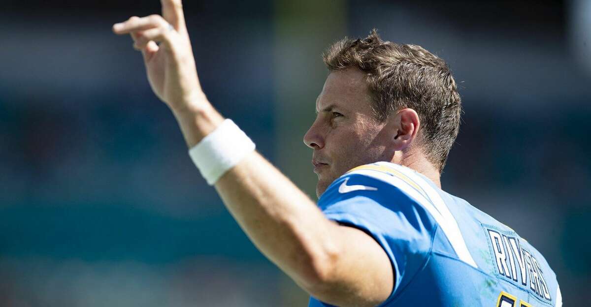 Los Angeles Chargers quarterback Philip Rivers waves to the crowd during a win over the Dolphins in September. (Allen Eyestone/The Palm Beach Post/TNS)