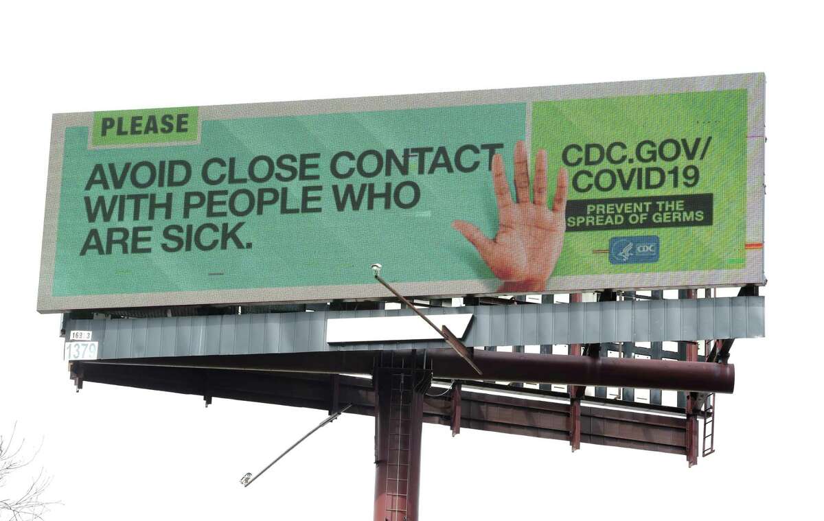 An electronic billboard from the CDC displays information about COVID-19 for cars traveling on Interstate 91 in New Haven on March 17, 2020.
