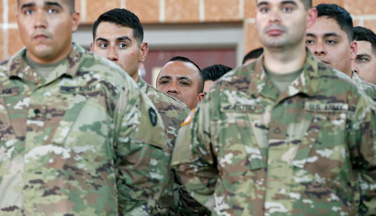 Members of the Texas Army National Guard listen to Texas Gov. Greg Abbott speak at the Sergeant Tomas Garces Texas Army National Guard Armory Thursday April 12, 2018 in Weslaco, Tx.