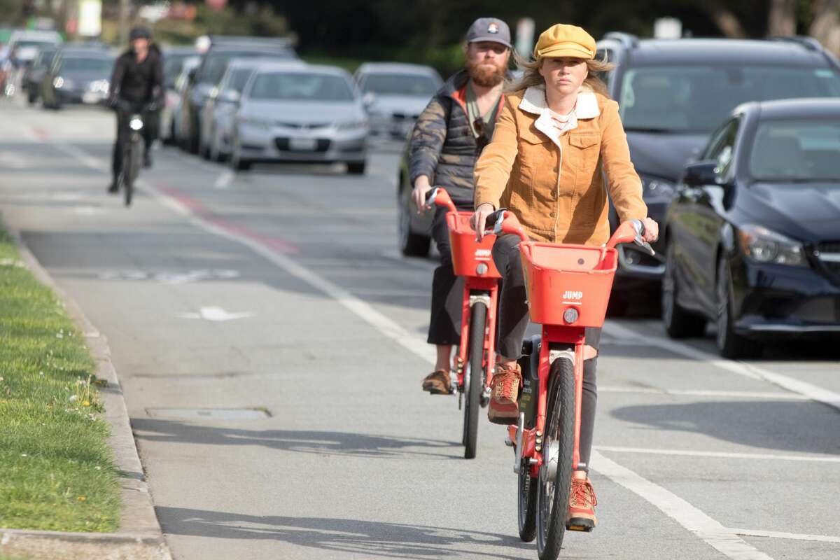Bicyclists ride along a bike path in Golden Gate Park. San Francisco had its first shelter-in-place day on March 17th, 2020 in response to the spread of the COVID-19 coronavirus.