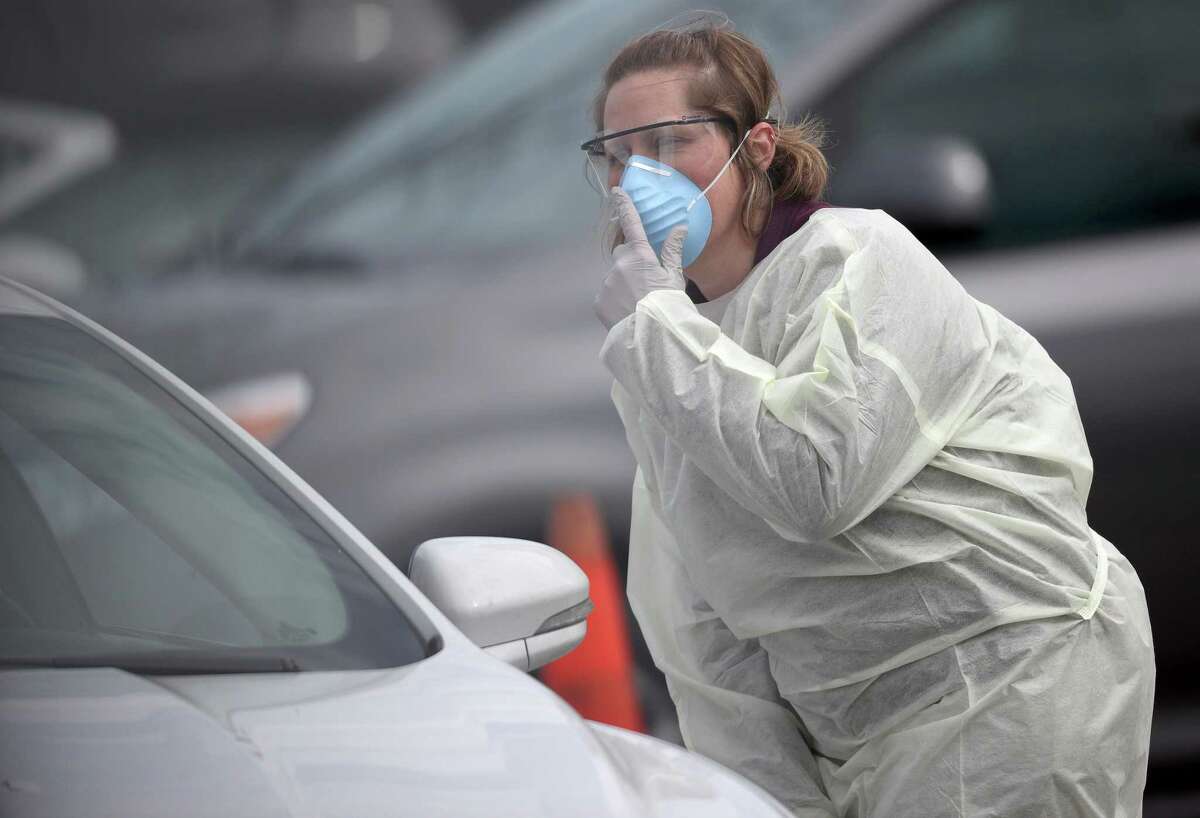 Nurses screen patients for COVID-19 virus testing at a drive-up location outside Medstar St. Mary's Hospital on March 17, 2020 in Leonardtown, Md. The facility is one of the first in the Washington, D.C., area to offer coronavirus testing.