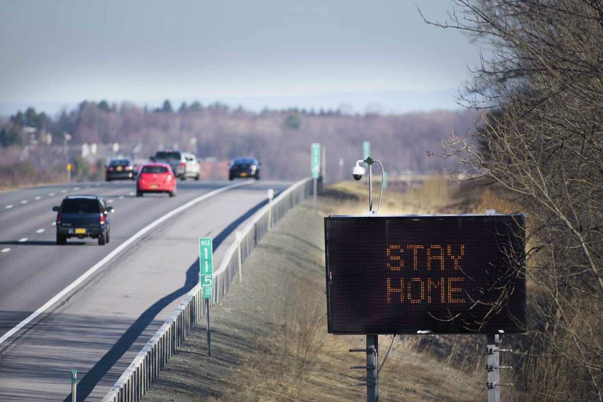 An electronic sign on the side of Interstate 90 westbound shows the message stay home on Wednesday, March 18, 2020, in East Greenbush, N.Y. (Paul Buckowski/Times Union)