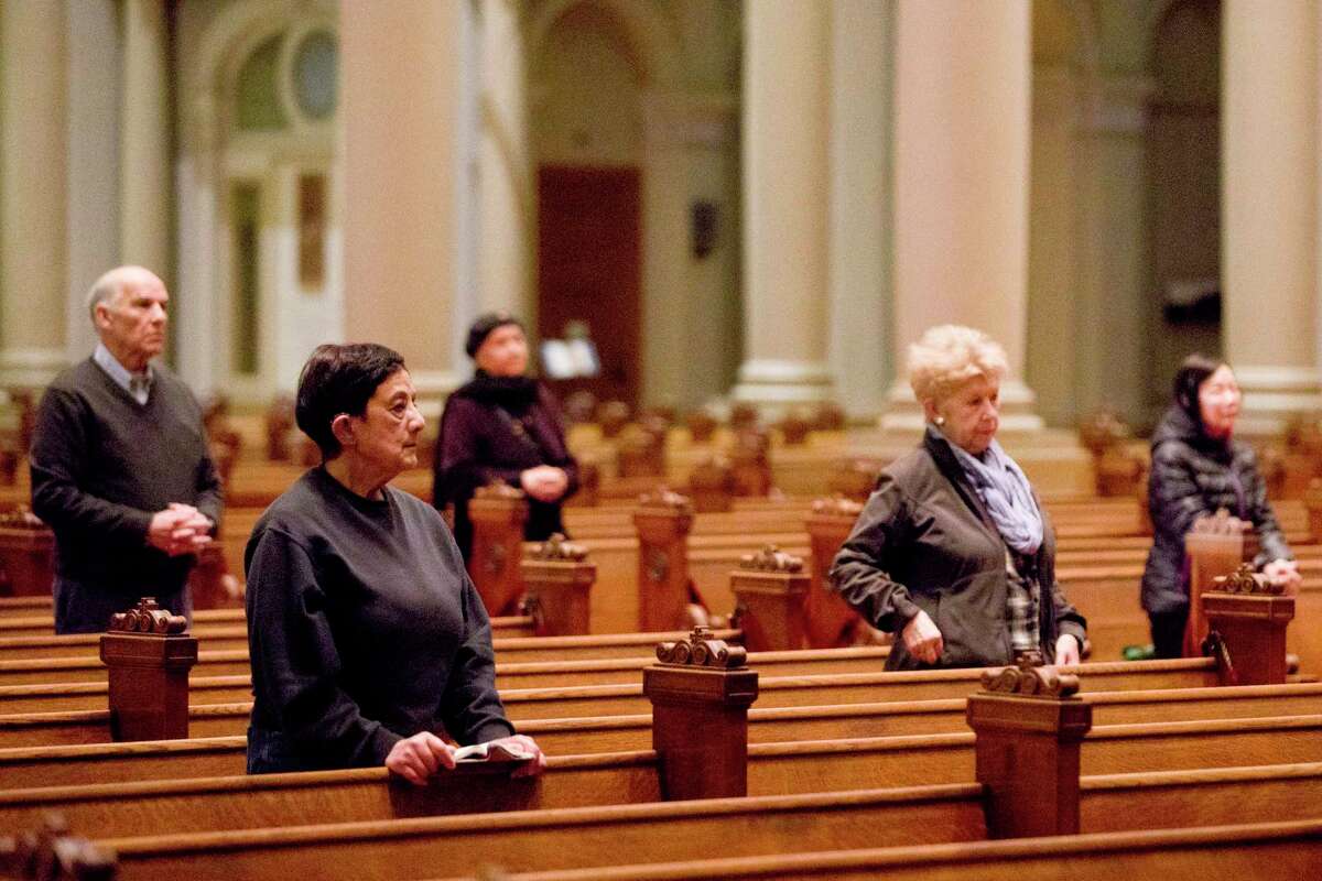 A small group of church attendees gather for mass in San Francisco, Calif. Many people have turned to online forms of worship. During a national emergency, it’s just as important to care for your soul as it is to wash your hands. Pray. Meditate. Listen to music. Watch a movie. Breathe.