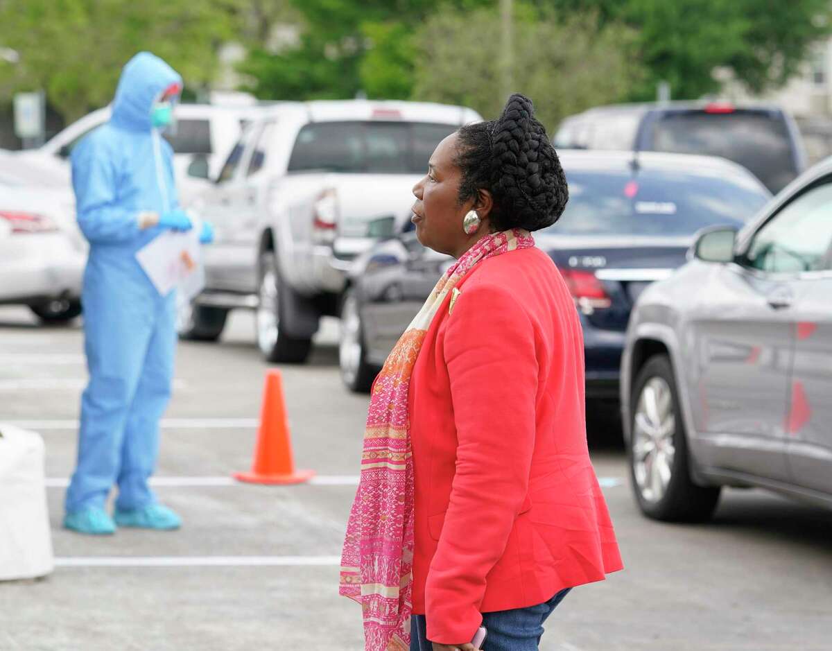 Congresswoman Sheila Jackson Lee, Chair of the Congressional Coronavirus Task Force, watches as workers evaluation people at the first stop at a coronavirus drive-thru testing area United Methodist Medical Center, 510 West Tidwell, Thursday, March 19, 2020 in Houston. The Congresswoman held a media conference at the center to urge residents with symptoms of the coronavirus to take free testing.