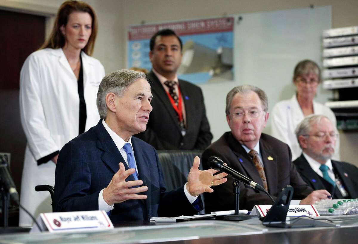 Texas Governor Greg Abbott addresses the media about the coronavirus death of Patrick James who resided at the Texas Masonic Retirement Center in Arlington. The press conference was held at the Arlington Emergency Management office, Wednesday March 18, 2020. Texas Governor Greg Abbott (center) addresses the media about the coronavirus death of at the Arlington Emergency Management office, Wednesday March 18, 2020. The Governor was joined by Arlington Mayor Jeff Williams (left), Tarrant County Judge Glen Whitley (right) and Department of State Health Services (DSHS) Commissioner John Hellerstedt, MD (far right). (Tom Fox/The Dallas Morning News/TNS)