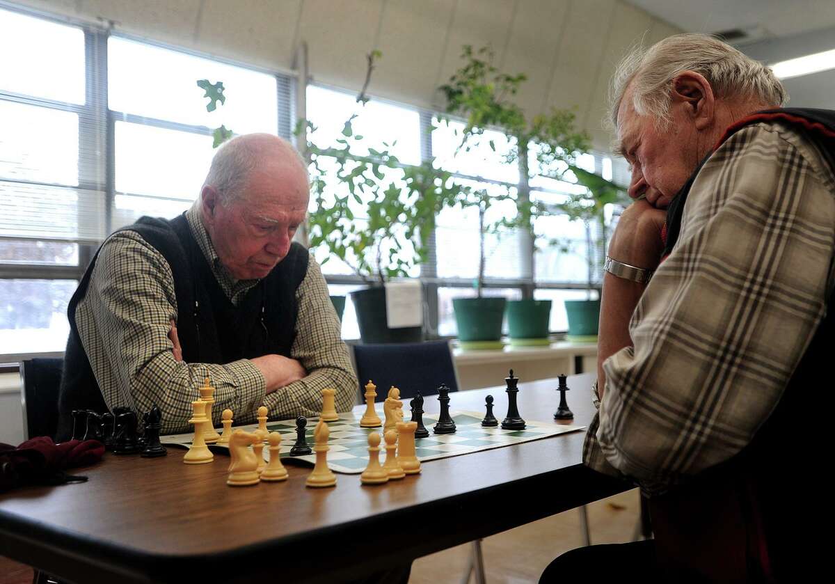 Frank DeStefano, left, of Fairfield, and Teo Perrini, of Shelton, play a game of chess as part of the Fairfield Senior Chess Club at the Bigelow Center for Senior Activities in 2018