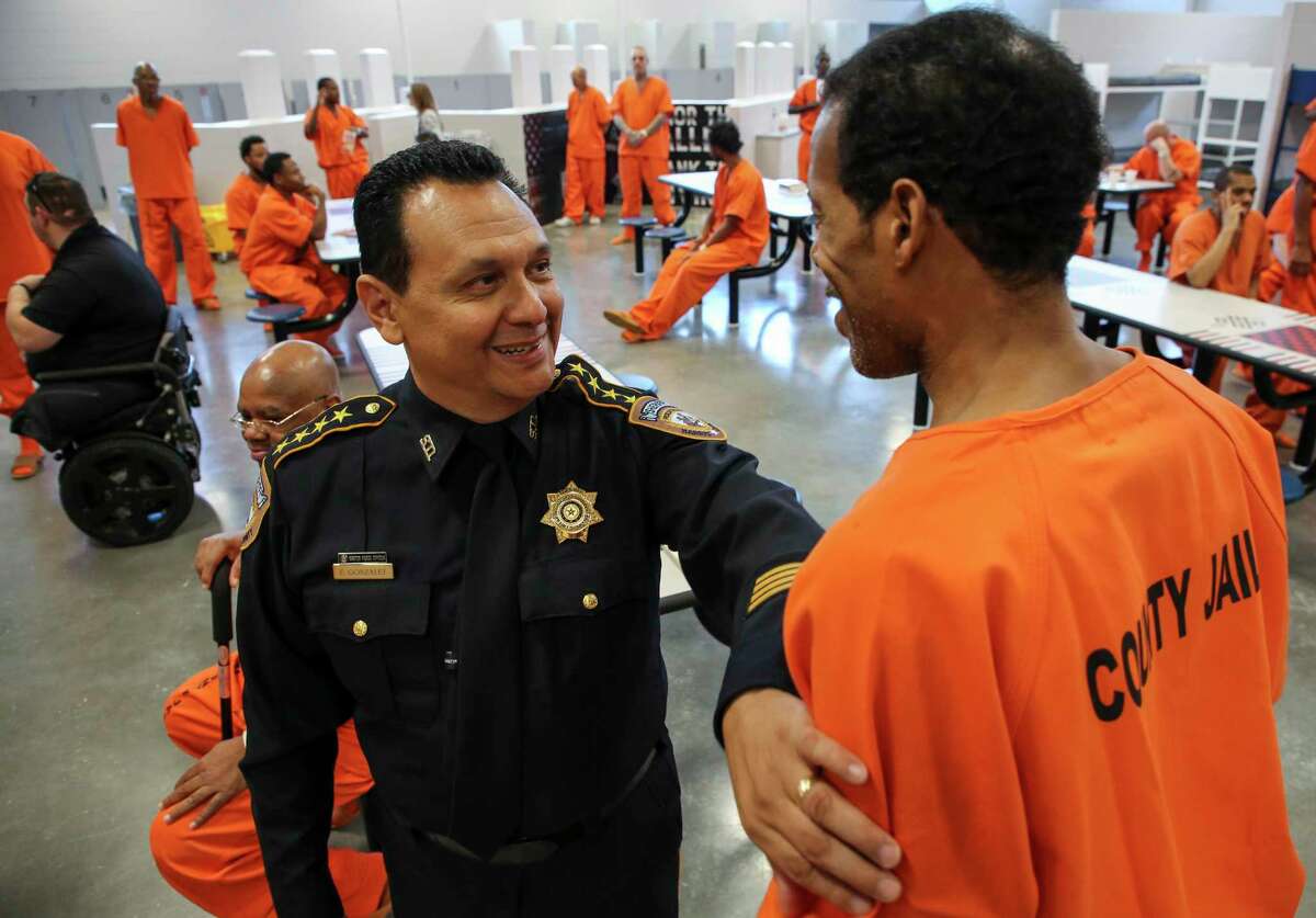 Harris County Sheriff Ed Gonzalez talks with Navy veteran Kenneth Martin, 55, inside the Harris County Joint Processing Center Thursday, July 25, 2019, in Houston. These inmates have been identified as U.S. armed force veterans and have been placed in the Brothers in Arms program. Through this program, veterans in the jail will be able to live together and receive veteran-targeted resources and services.