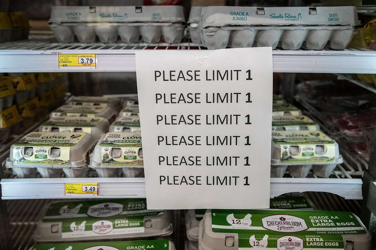 A sign asks customers to limit themselves to one carton of eggs as seniors shop at Zanotto’s Willow Glen Market Thursday, March 19, 2020, in San Jose, Calif. The store is open only to seniors from 8 - 9 a.m.