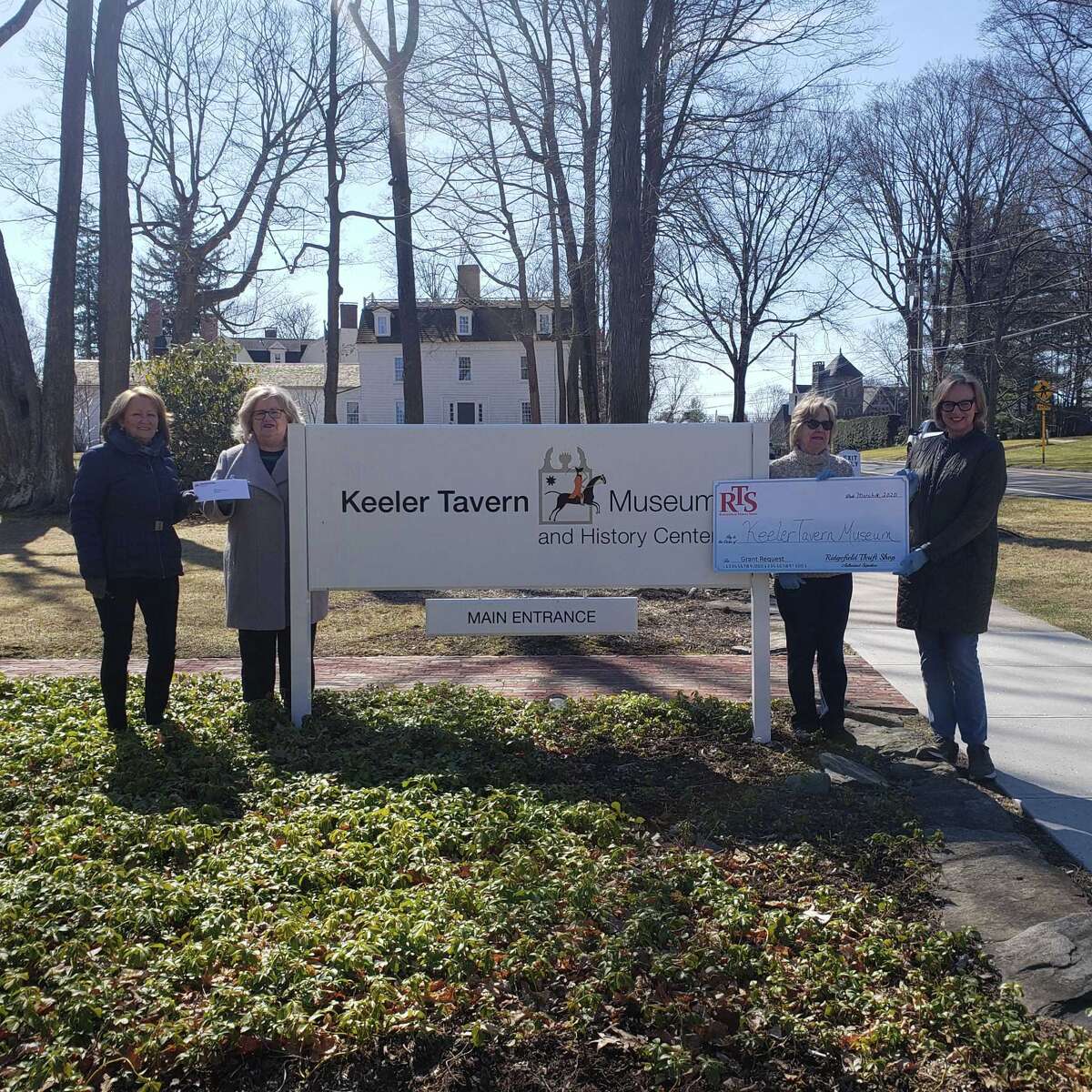 Ridgefield Thrift Shop (RTS) volunteer Mary Coleman, far left, hand-delivered a check to Keeler Tavern Museum & History Center (KTM&C) Board President Rhonda Hill on March 16, while RTS volunteer, Marilyn Maneri, center right, stands with Hildegard Grob, KTM&C’s executive director.