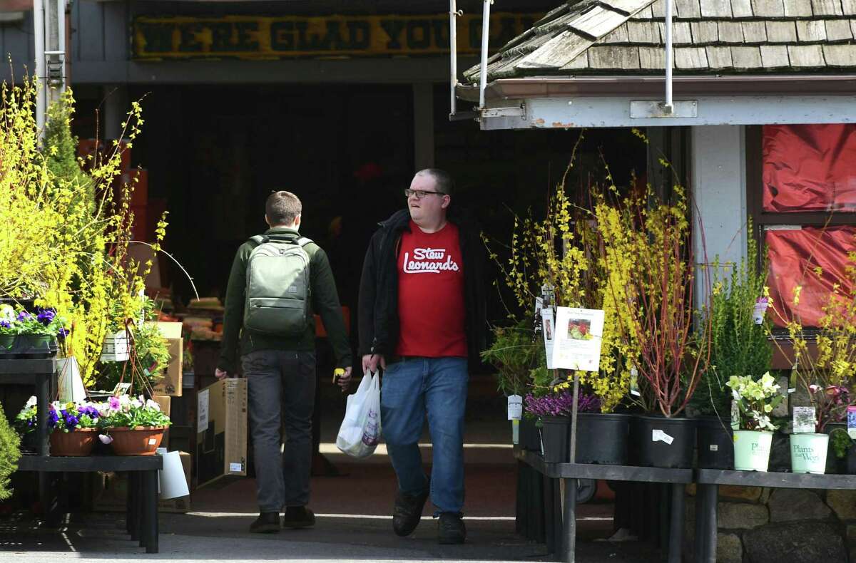 Shoppers head in and out of Stew Leonard’s in Norwalk on Wednesday.