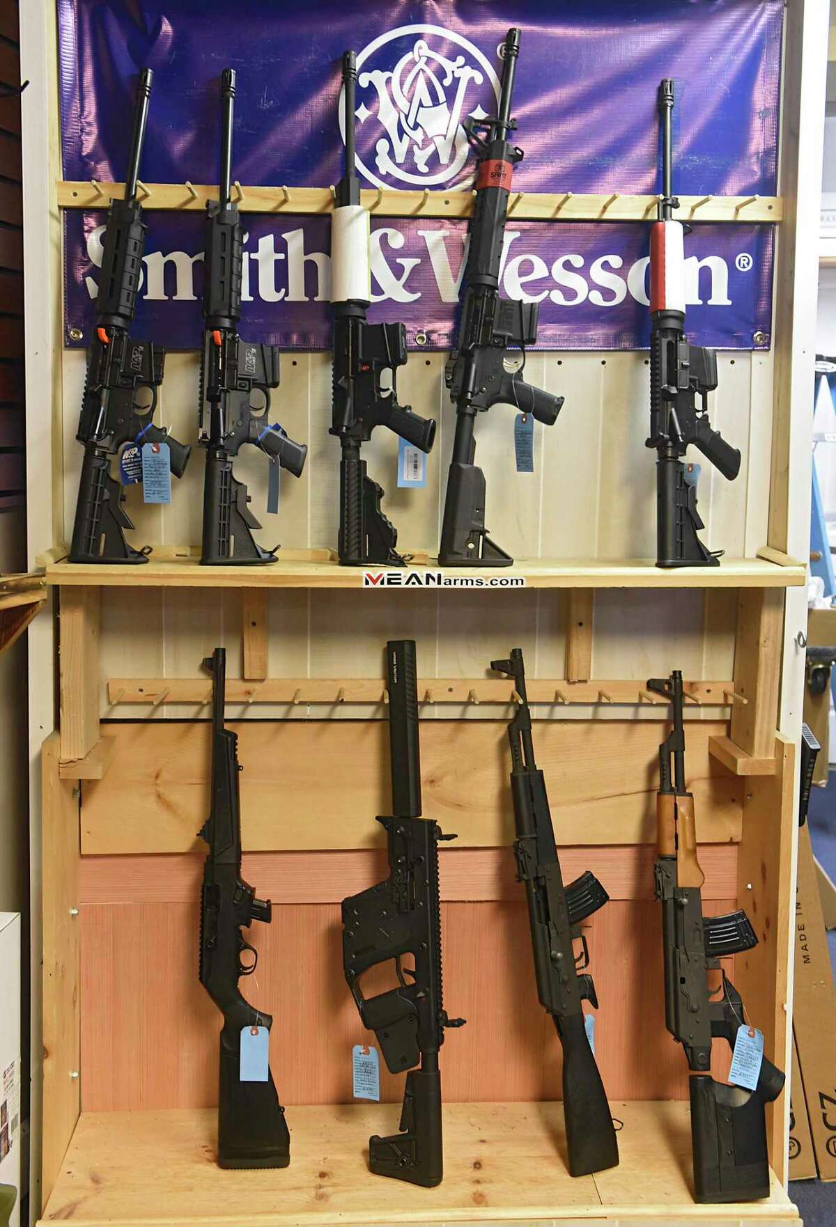 Semi-automatic rifles are seen on display at Upstate Guns & Ammo store on Thursday, March 19, 2020 in Schenectatdy, N.Y. (Lori Van Buren/Times Union)