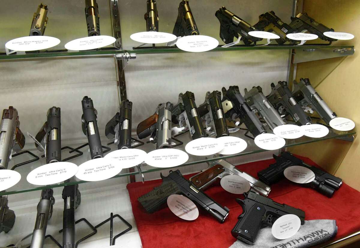 Semi-automatic pistols are seen in a display case at Upstate Guns & Ammo store on Thursday, March 19, 2020 in Schenectatdy, N.Y. (Lori Van Buren/Times Union)