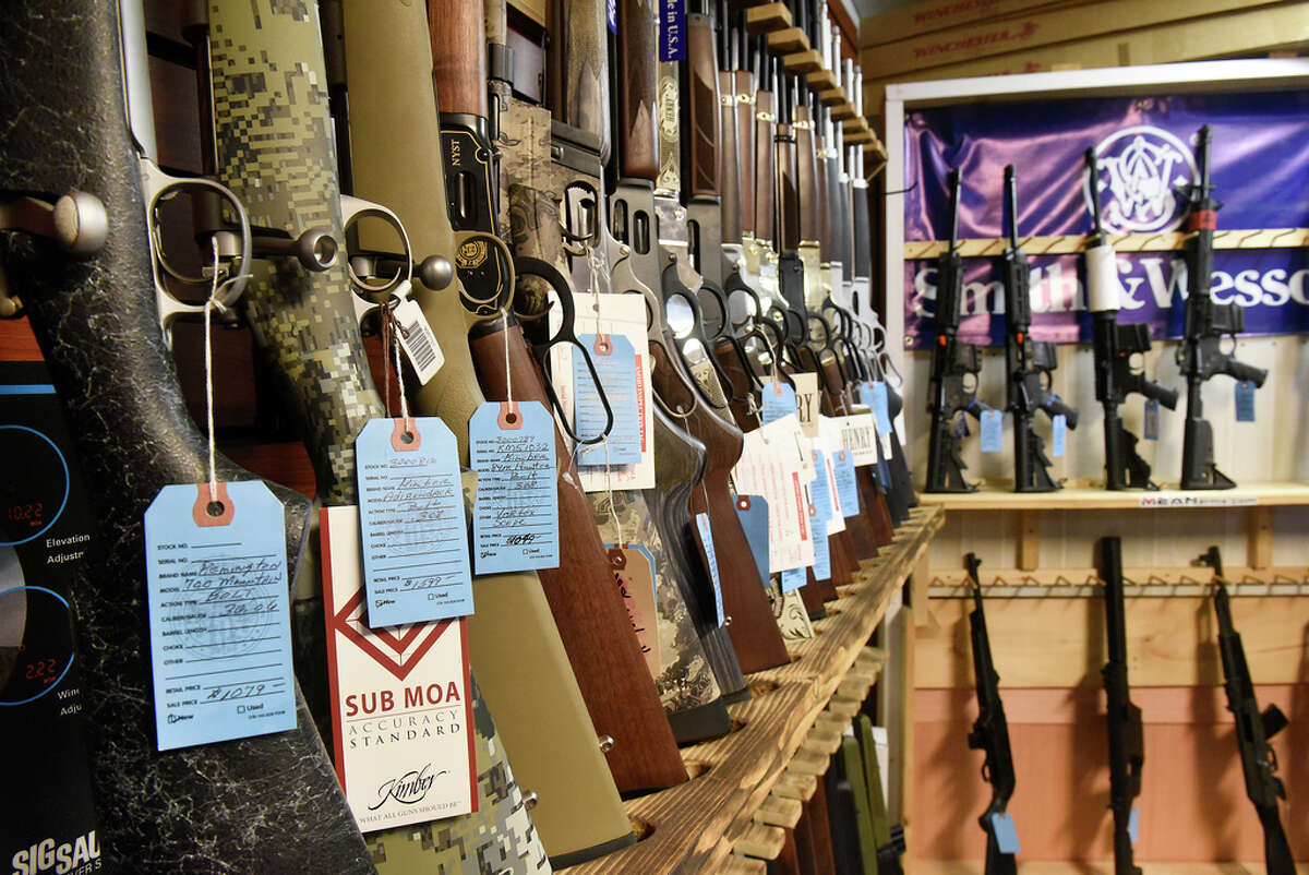 Bolt action, lever action and semi-automatic rifles are seen on display at Upstate Guns & Ammo store on Thursday, March 19, 2020 in Schenectady, N.Y. (Lori Van Buren/Times Union)