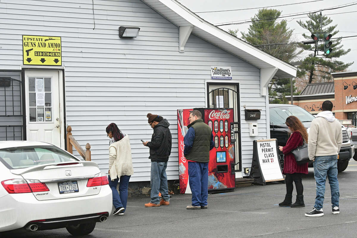People wait in line to shop at Upstate Guns & Ammo store on Thursday, March 19, 2020 in Schenectady, N.Y. (Lori Van Buren/Times Union)