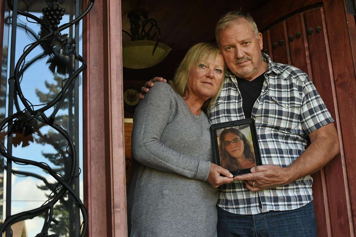 Liz and Mark Todd, at their home in Sonoma, Calif., hold a picture of their daughter Brittany Stewart Todd, 28, that she texted to them yesterday afternoon while she was in Nicaragua to show that she was doing OK after struggling to get a flight back to California due to COVID-19 travel restrictions on Thursday, March 19, 2020. Brittany had been in Cancun, Mexico for a bachelorette party last week then had to journey through four different countries in order to make her way back to her home in Petaluma, California today.