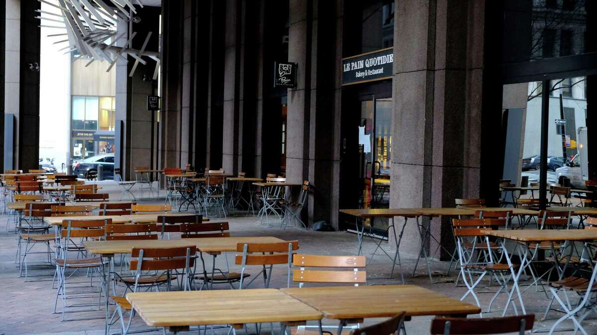 Empty tables are seen on Broad Street in the Financial District area of New York City this week.