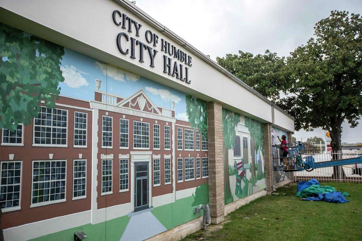 The City of Humble plans to focus on infrastructure this year according to City Manager Jason Stuebe. Pictured: Muralist Suzanne Sellers continues work on her piece honoring the legacy of Humble on Dec. 4, 2013, at Humble City Hall. (Photo by ANDREW BUCKLEY/The Observer)