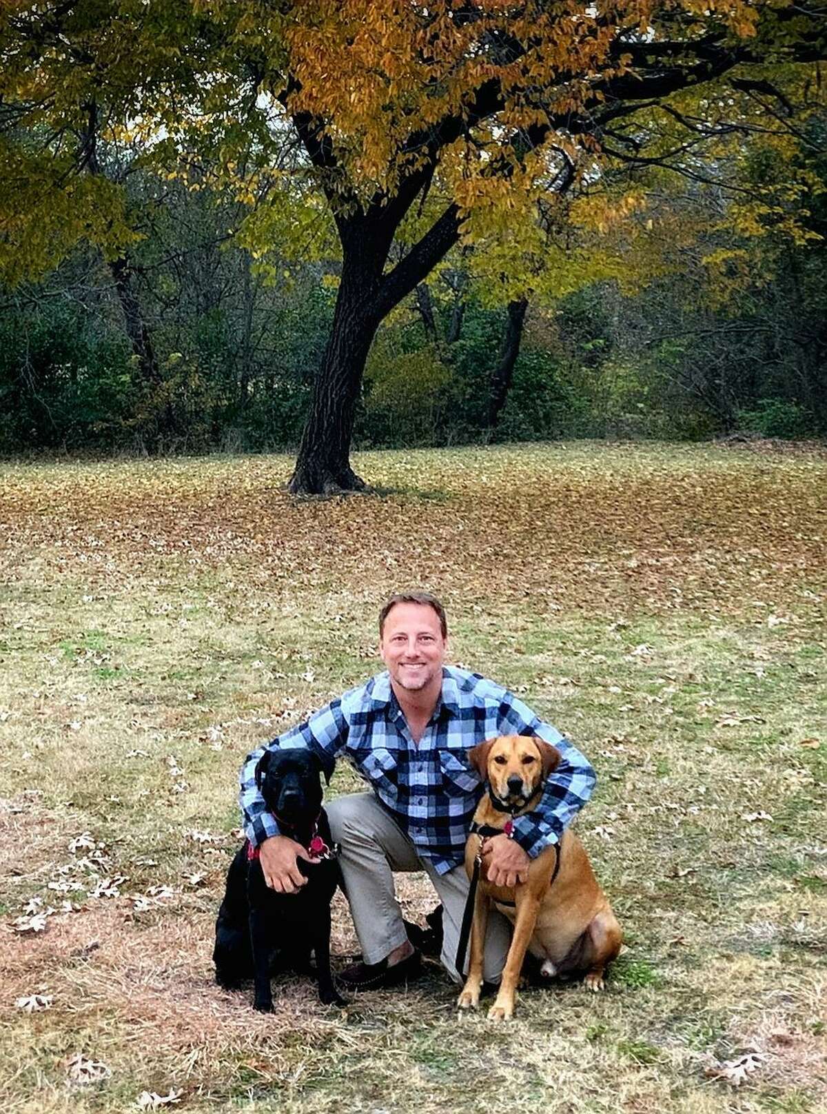 Chris Lierle poses with his dogs while waiting for the lab result of a novel coronavirus test. He felt sick after a road trip from Houston, Texas, to San Francisco, California that he made from late Februart to early March 2020.