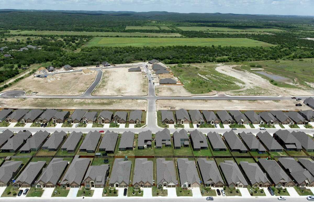 Rows of completed homes stand Wednesday, May 23, 2018 next to another development under construction on San Antonio's West Side north of Culebra Road and west of Loop 1604. Officials with San Antonio and Bexar County plan to ask Gov. Greg Abbott to freeze property values for a year in the wake of the coronavirus pandemic.