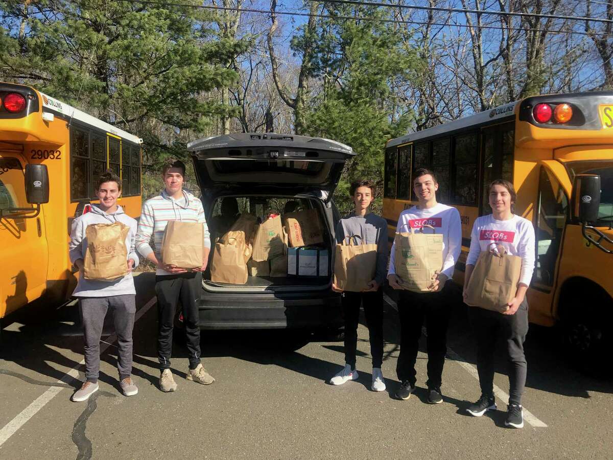 New Canaan High School Service League of Boys (SLOBs) members Ashton Healey, Douglas Gillespie, Justin Generalis, Will Galvan and Payton Welch.
