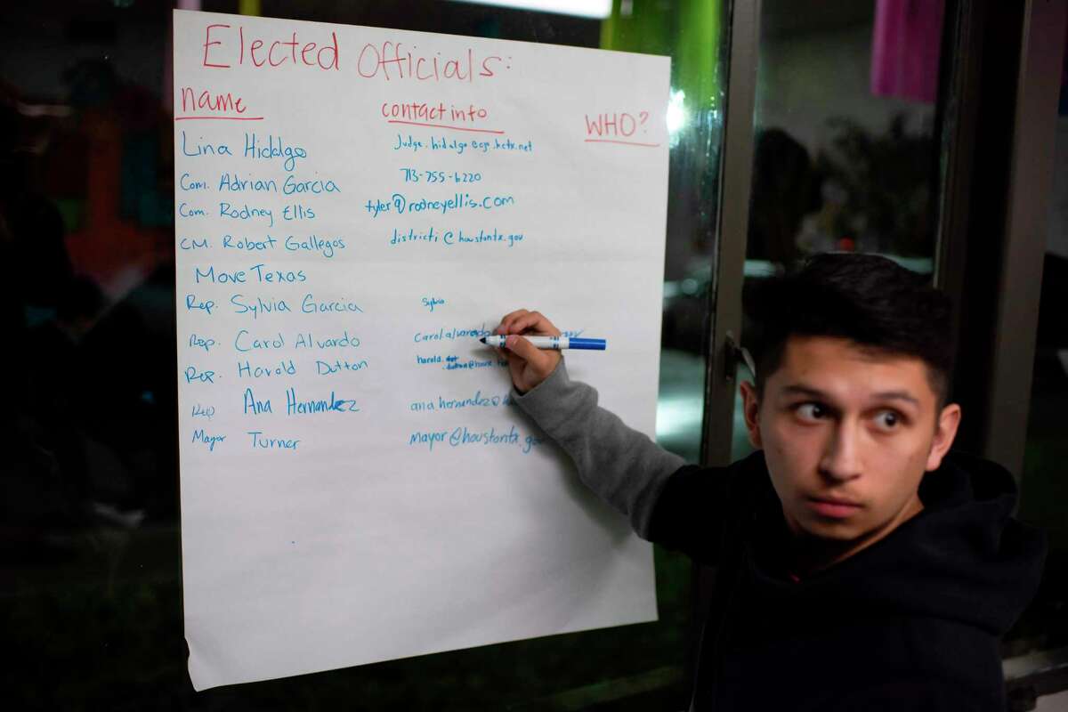 Volunteer Michael Garza makes a list of government officials to invite to an upcoming block party at the headquarters of Jolt, a non-profit organization that works to increase the civic participation of Latinos in Texas, in Houston, Texas on February 20, 2020. - US census data shows that Texas's Hispanic population grew from 9.5 to 11.4 million between 2010 and 2018, and is on track to become the largest population group in the state by 2022. That mirrors the trend nationwide where a record 32 million Latinos are projected to be eligible to vote in 2020, surpassing blacks as the largest minority group in the electorate, according to Pew Research. That is a four million increase since 2016. But turnout has been a persistent challenge: since 1996, Pew data shows that most eligible Latinos have not cast ballots in US presidential elections. (Photo by Mark Felix / AFP) (Photo by MARK FELIX/AFP /AFP via Getty Images)