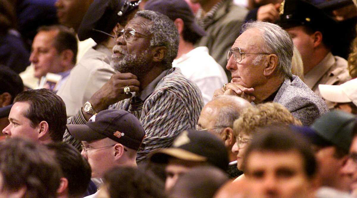 Gary Pomerantz's book about the relationship between Celtics greats Bill Russell, left, and Bob Cousy touches upon the racial divide during their years as teammates.