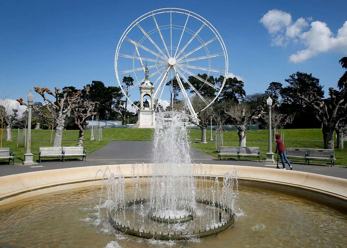 The 150-foot high SkyStar Ferris wheel is assembled at the eastern end of the Music Concourse at Golden Gate Park in San Francisco, Calif. on Friday, March 20, 2020. The opening of the "observation" wheel, erected to commemorate the 150th anniversary of the park, was delayed by the coronavirus pandemic.