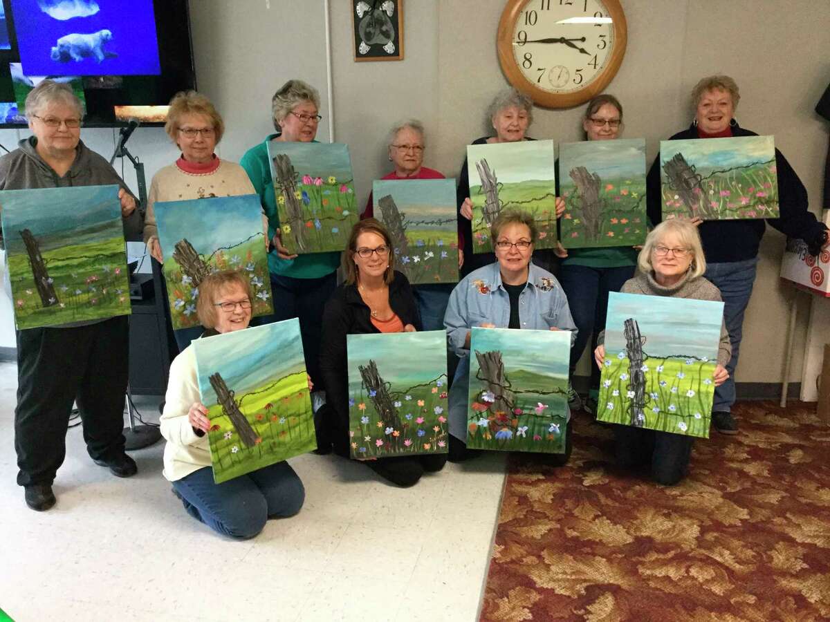 Painters show off their work after a March 13 painting class with Deb. (Courtesy Photo)