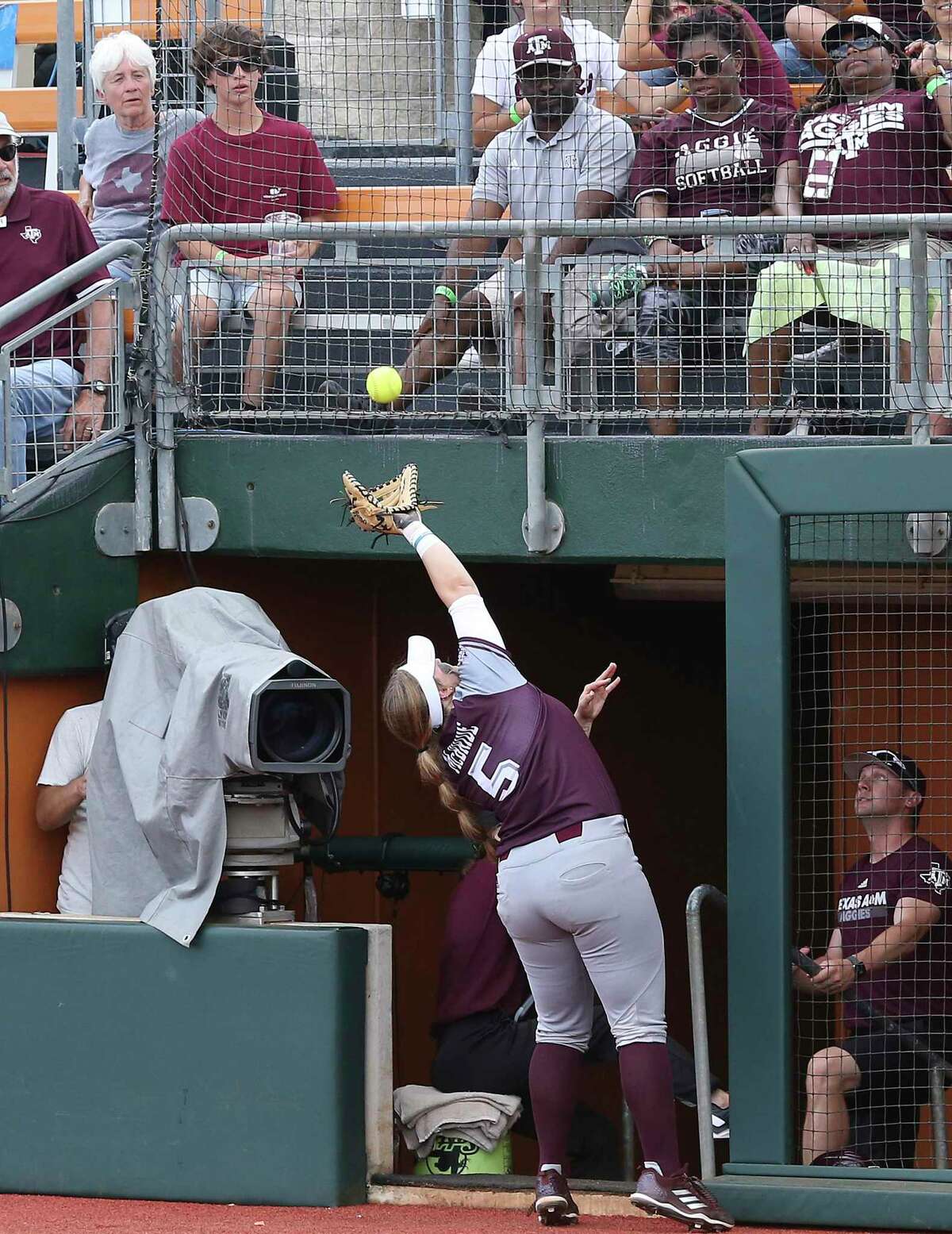 Aggies first baseman Payton McBride stretches to catch a foul ball above the dugout as Houston beats Texas A&M 3-1 in the NCAA regional tournament at MCCombs Field in Austin on May 17, 2019.