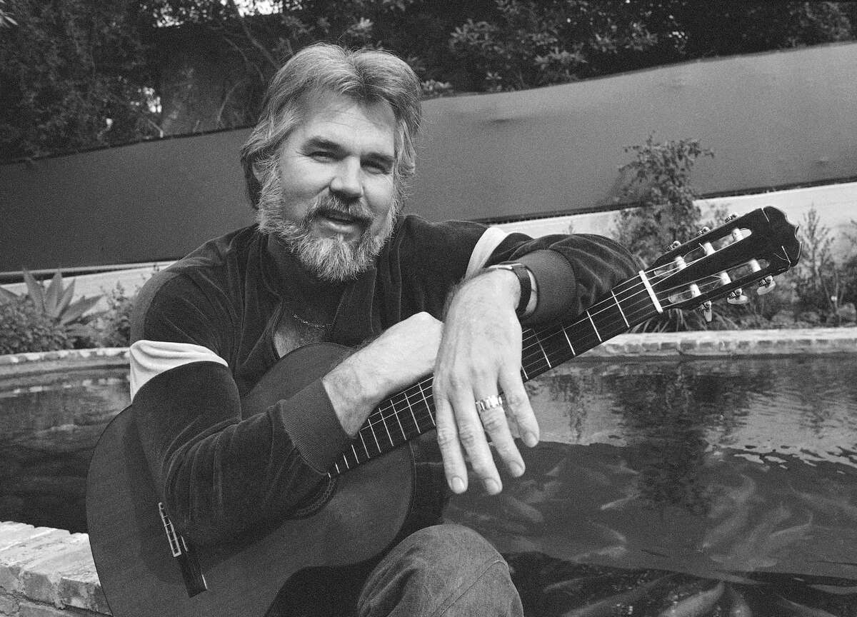 FILE - This Feb. 20, 1978 file photo shows Kenny Rogers at his home in Brentwood, Calif. Rogers, who embodied aThe Gamblera persona and whose musical career spanned jazz, folk, country and pop, has died at 81. A representative says Rogers died at home in Georgia on Friday, March 20, 2020. (AP Photo/Wally Fong, File)