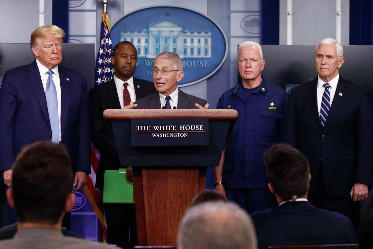 Director of the National Institute of Allergy and Infectious Diseases Dr. Anthony Fauci speaks during a coronavirus task force briefing at the White House, Saturday, March 21, 2020, in Washington. From left, President Donald Trump, Housing and Urban Development Secretary Ben Carson, Fauci, Adm. Brett Giroir, assistant secretary for health, and Vice President Mike Pence.