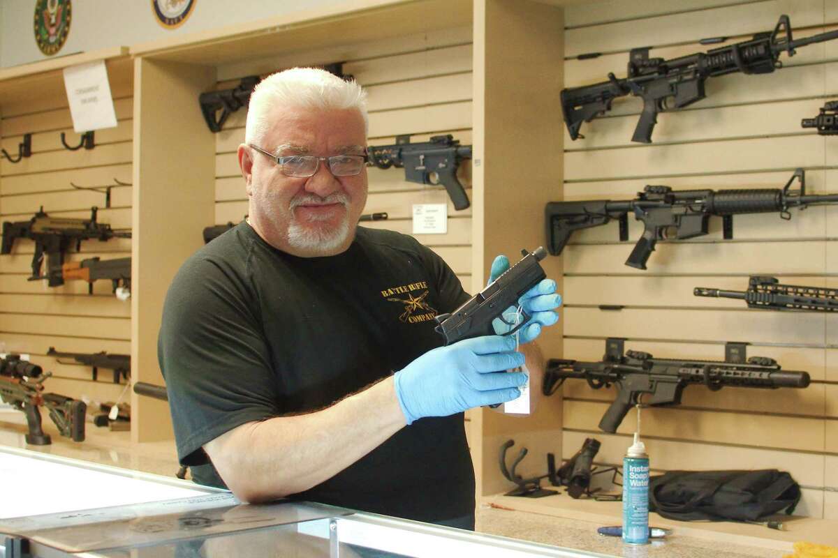 Battle Rifle Co. owner Chris Kurzadowski says sales have been brisk at his business. “People who have never owned a gun are walking into the store,” he says.
